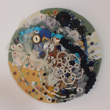 Circle abstract embroidery piece Moonlight. Made with many buttons and net. A huge mix of colours.